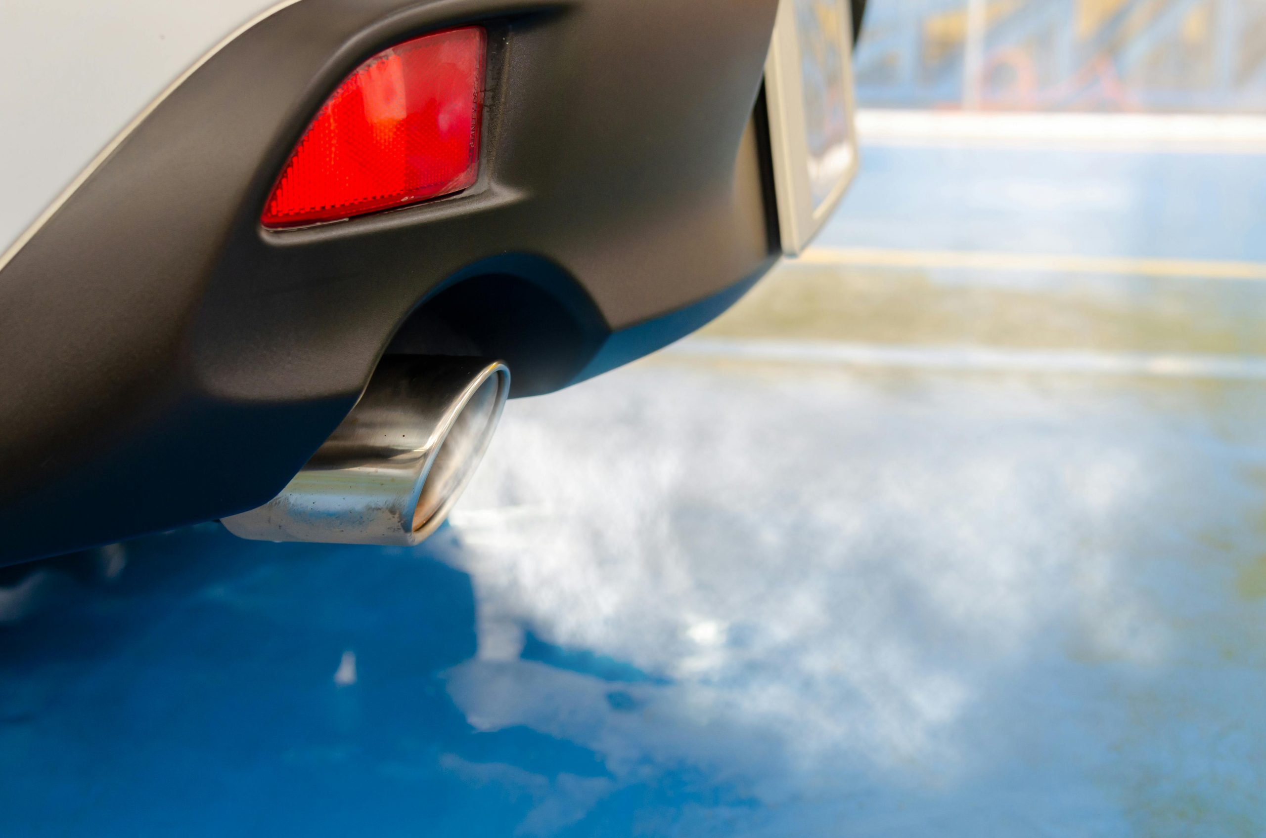 close-up of white smoke from a car's exhaust