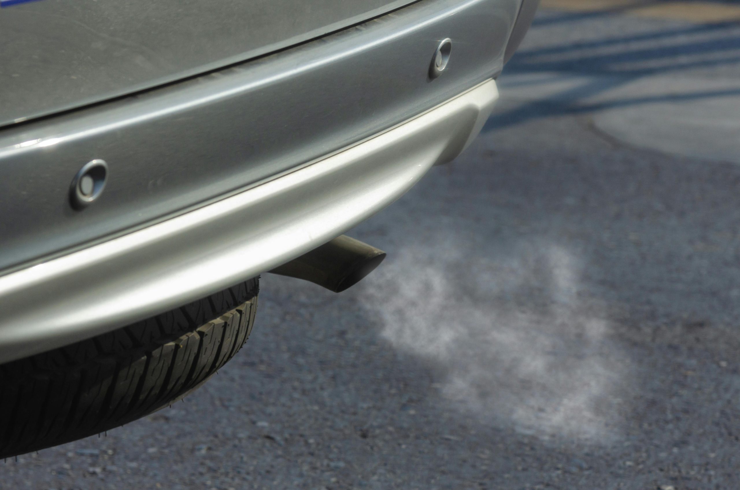 close-up of white smoke from a car's exhaust